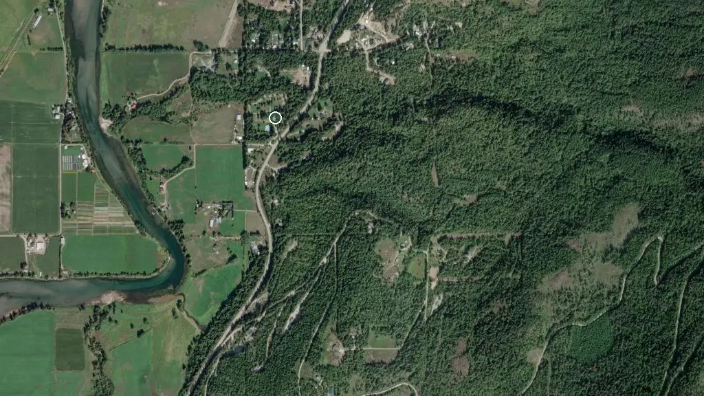 Aerial view of Whispering Pines RV Park and surroundings