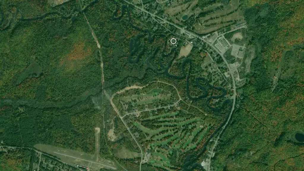 Aerial view of River Bend Cabins Tent Trailer Park and surroundings